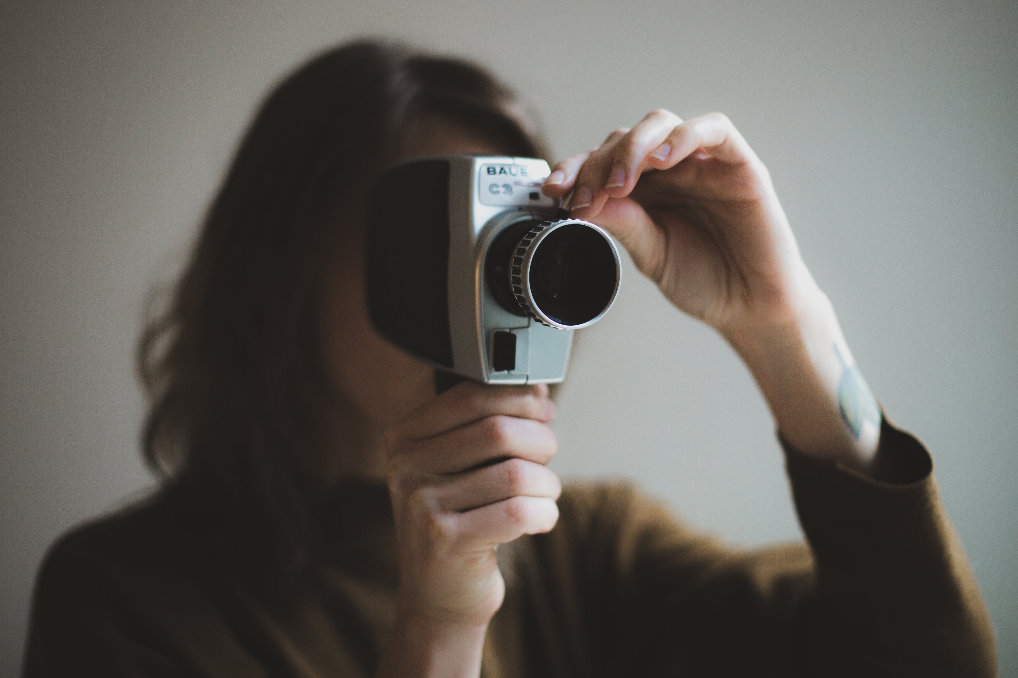 A film camera and storyboards on a production desk